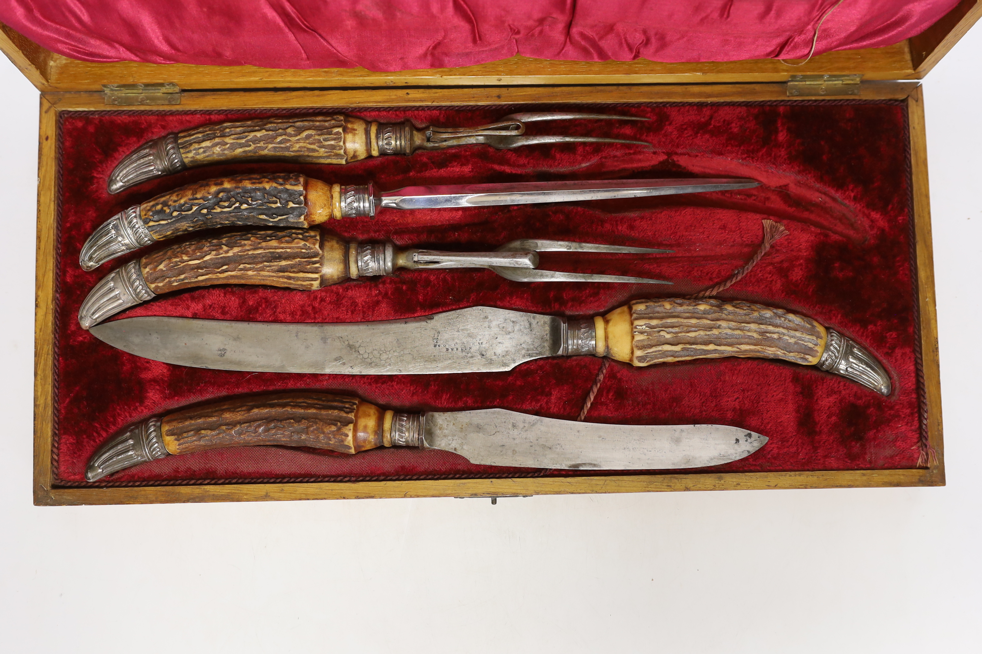 A Victorian E.R. Moore & Co cased horn handled five piece carving set